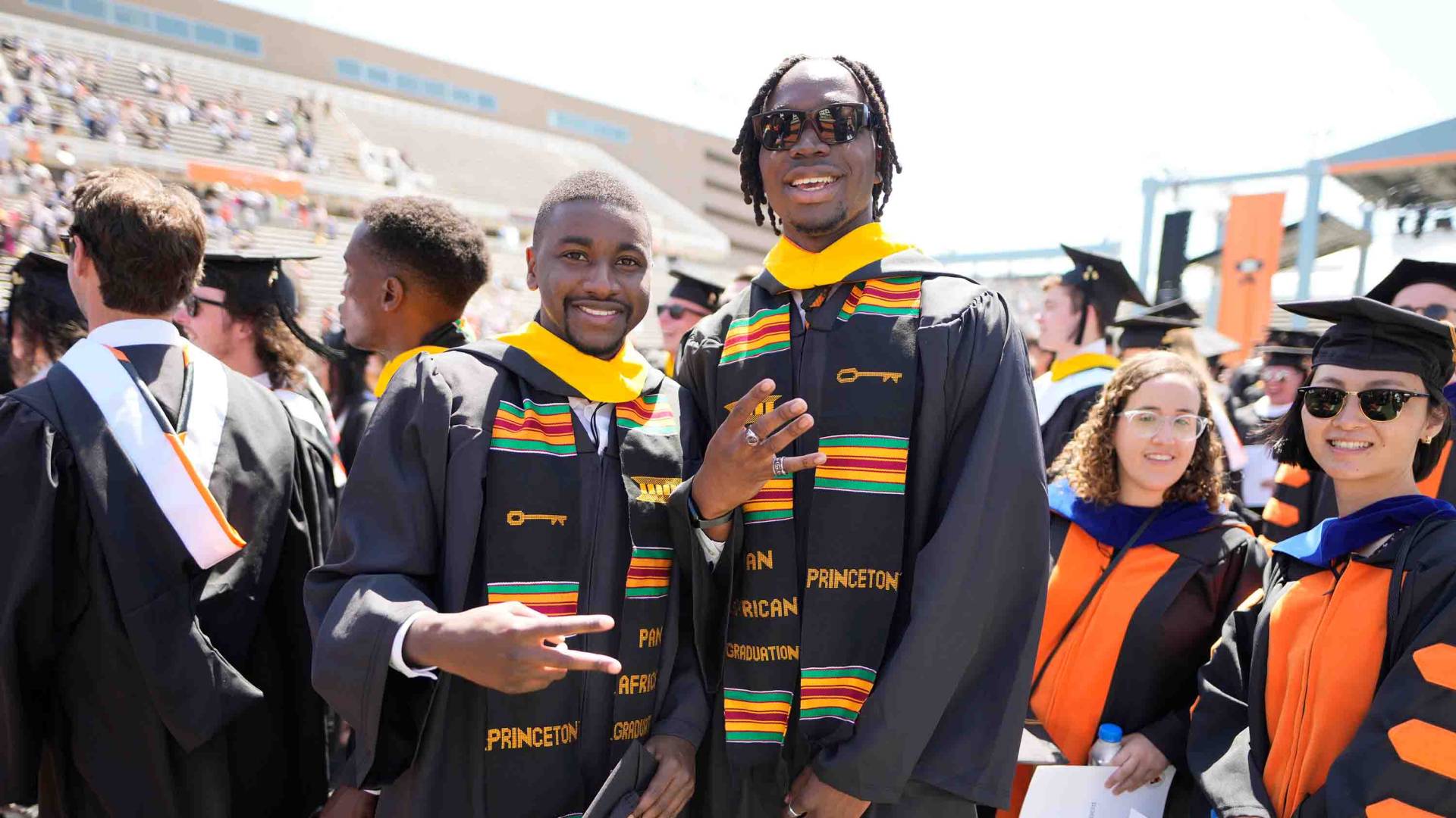 Graduating students smiling