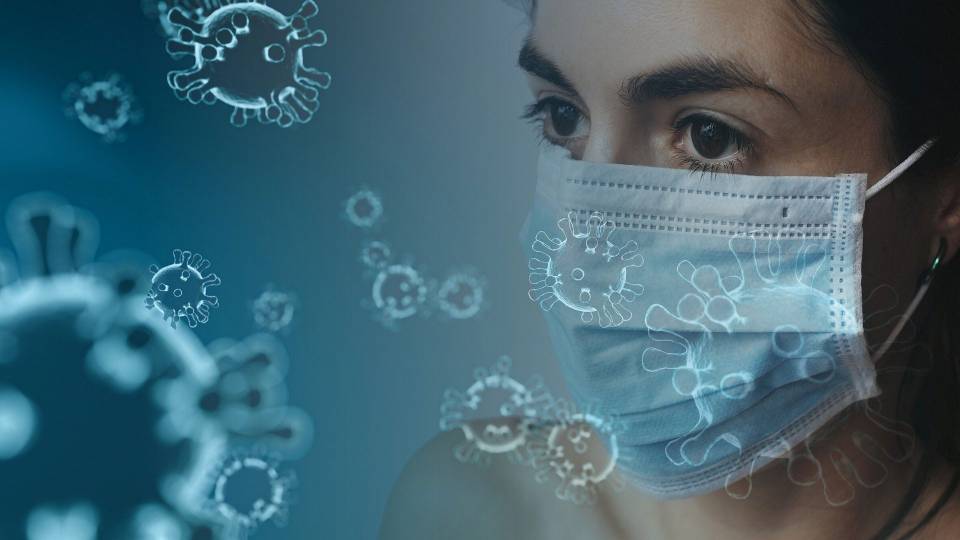 illustration of coronovirus with a masked person