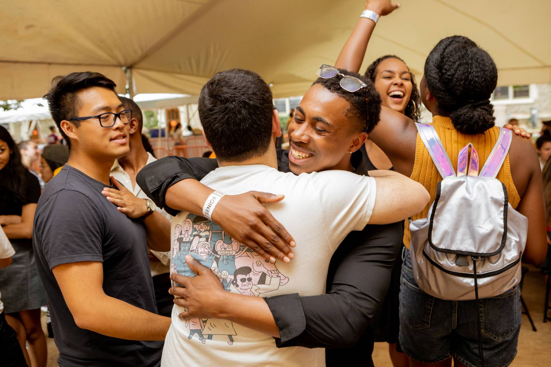 Alumni hug in greeting