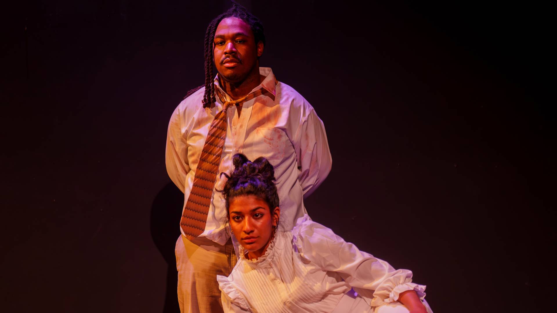 two actors on stage