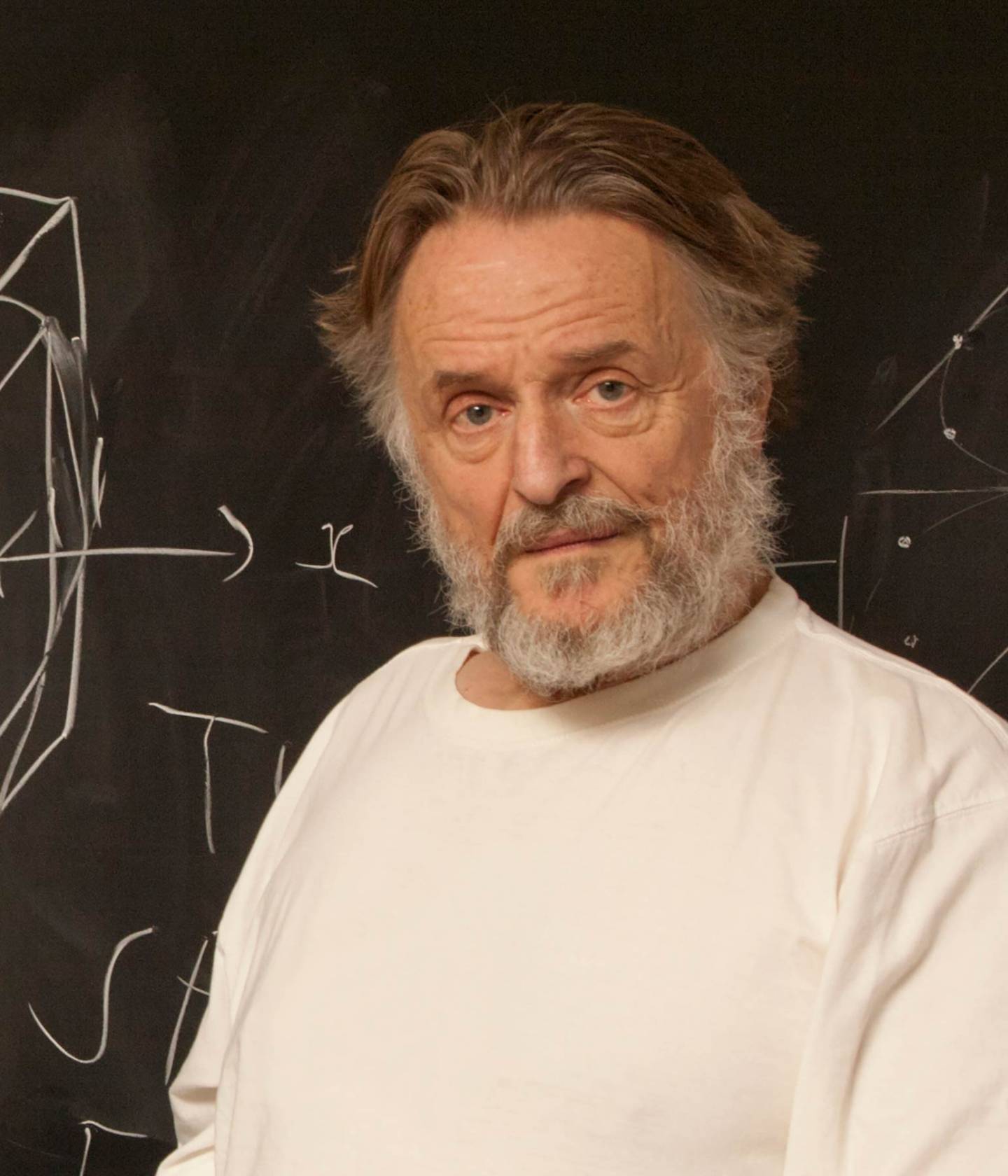 John Conway in front of a blackboard